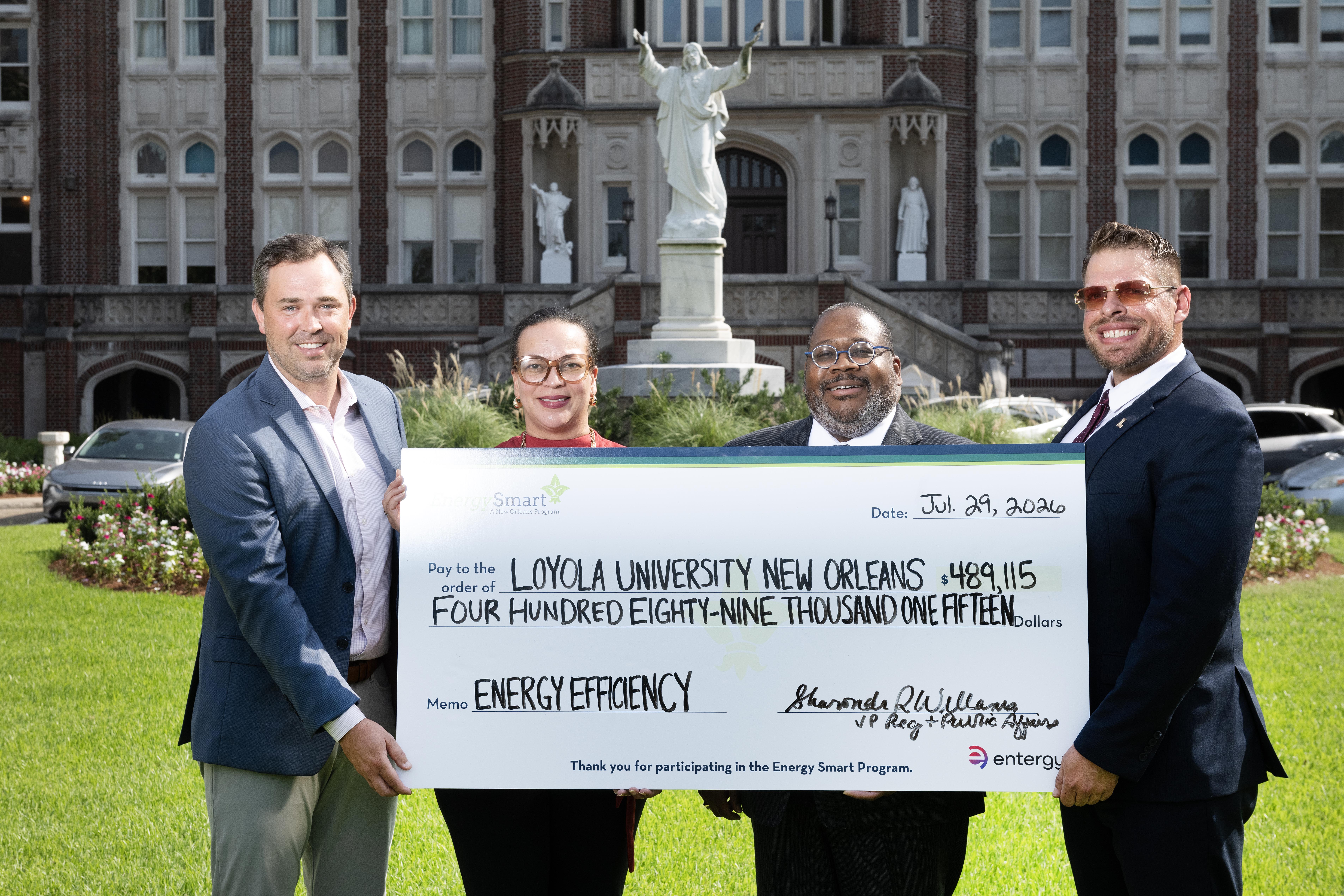 Loyola New Orleans and Entergy New Orleans and Energy Smart at check presentation