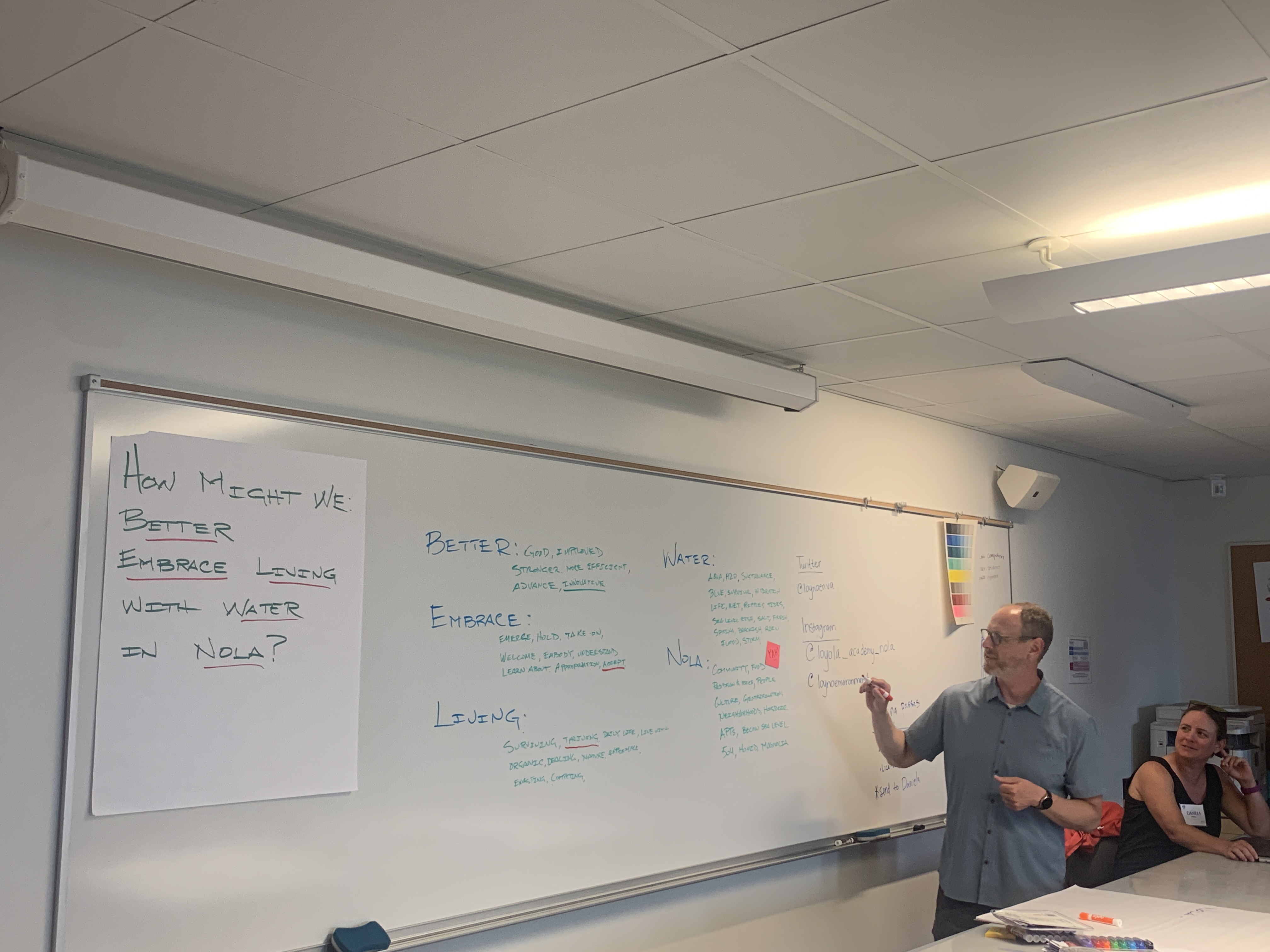 Professor writing on a board 